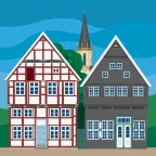 A historic timber-framed building and a historic slate building at the Alte Kirchplatz in Gütersloh, Germany.