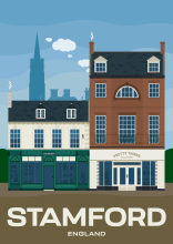 Two beautiful historic buildings with storefronts on the High Street of Stamford in Lincolshire, England.