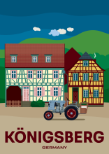 A tractor in front of two beautiful timber-framed buildings in historic Königsberg in Bavaria, Germany.